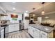 Well-lit kitchen with a granite island, stainless steel appliances, and wood-look floors at 2984 Starnes Dr, Rock Hill, SC 29730