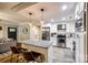 Open kitchen with a granite island, stainless steel appliances, and seamless flow to the living area at 2984 Starnes Dr, Rock Hill, SC 29730