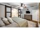Serene main bedroom featuring a decorative barn door to the ensuite bathroom and a ceiling fan at 2984 Starnes Dr, Rock Hill, SC 29730