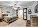 Stylish main bedroom showcasing a barn door to bathroom, wood floors, and natural light at 2984 Starnes Dr, Rock Hill, SC 29730