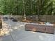 Large concrete patio with outdoor seating and a hammock in a private, wooded backyard at 3210 Crow Row, Monroe, NC 28112