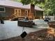 Spacious backyard with large concrete patio, outdoor furniture, grill, and access to the house at 3210 Crow Row, Monroe, NC 28112