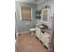 Bathroom with double sink vanity, stylish lighting, a shade window, and tile flooring at 3210 Crow Row, Monroe, NC 28112