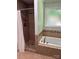 Elegant bathroom featuring tile shower, soaking tub, and tile surround at 3210 Crow Row, Monroe, NC 28112