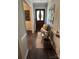 Inviting entryway with wood floors, a decorative chalkboard, and a cozy bench at 3210 Crow Row, Monroe, NC 28112