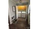 Functional laundry area with washer, dryer, storage cabinets and dark wood flooring at 3210 Crow Row, Monroe, NC 28112