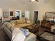 Spacious living room with a large sofa, wood floors, and cozy decor at 3210 Crow Row, Monroe, NC 28112