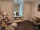 Cozy office with neutral walls, dark wood floors and natural light at 3210 Crow Row, Monroe, NC 28112