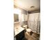 Cozy bathroom featuring a shower, toilet, vanity, and a cabinet for essential storage at 34107 Watson Rd, Albemarle, NC 28001
