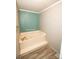 Bathroom featuring a soaking tub with jets, offering a private space to unwind and relax at 34107 Watson Rd, Albemarle, NC 28001