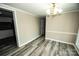 Bright dining room featuring laminate flooring and contemporary lighting fixture at 34107 Watson Rd, Albemarle, NC 28001
