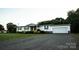 Charming single story home with a gravel driveway and an attached two car garage at 34107 Watson Rd, Albemarle, NC 28001