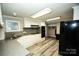 Modern kitchen featuring white cabinets, gray countertops and stainless steel appliances at 34107 Watson Rd, Albemarle, NC 28001
