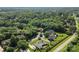 An aerial view of the home situated on a lush, tree-filled lot with approximate boundary lines shown at 3916 2Nd Street Nw Dr, Hickory, NC 28601