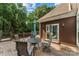 Outdoor back deck with table and chairs, perfect for relaxing and enjoying the scenery at 3916 2Nd Street Nw Dr, Hickory, NC 28601