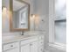 Bright bathroom boasts a vanity with drawers, a large mirror and modern fixtures for a luxurious feel at 3916 2Nd Street Nw Dr, Hickory, NC 28601