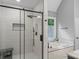 This bathroom features a modern shower with a sleek glass door, large window, and separate soaking tub at 3916 2Nd Street Nw Dr, Hickory, NC 28601