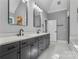 Well-lit bathroom with double sinks and stylish vanity is complimented by a large mirror and neutral decor at 3916 2Nd Street Nw Dr, Hickory, NC 28601