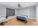 Cozy bedroom with ceiling fan, hardwood floors, and ample natural light at 3916 2Nd Street Nw Dr, Hickory, NC 28601