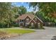 The front of this stately home features a tree-lined driveway, mature trees, and manicured landscaping at 3916 2Nd Street Nw Dr, Hickory, NC 28601