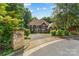 Charming exterior view showcases a meticulously landscaped front yard and a brick mailbox near the entrance at 3916 2Nd Street Nw Dr, Hickory, NC 28601