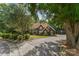 A tree-lined driveway leads to this spacious home with manicured landscaping, offering curb appeal at 3916 2Nd Street Nw Dr, Hickory, NC 28601
