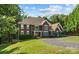 Stately two-story home boasts a well-manicured lawn, mature trees, and a welcoming driveway at 3916 2Nd Street Nw Dr, Hickory, NC 28601