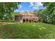 The back of the home showcases a deck and a ground-level covered patio, great for entertaining at 3916 2Nd Street Nw Dr, Hickory, NC 28601