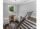 Grand foyer with high ceilings, statement chandelier and hardwood staircase make a striking first impression at 3916 2Nd Street Nw Dr, Hickory, NC 28601