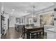 Bright eat-in kitchen boasts a large island, modern appliances, and a stylish dining area with decorative chandelier at 3916 2Nd Street Nw Dr, Hickory, NC 28601