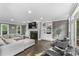 Comfortable living room with built-in shelving, a green marble fireplace, hardwood floors, and natural light at 3916 2Nd Street Nw Dr, Hickory, NC 28601
