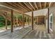 A ground-level outdoor patio with wooden support beams and open space, perfect for gatherings at 3916 2Nd Street Nw Dr, Hickory, NC 28601