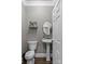 Cozy powder room features a pedestal sink and is perfect for guests to freshen up at 3916 2Nd Street Nw Dr, Hickory, NC 28601