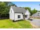 This home boasts light siding, a gray roof, and well-maintained landscaping, exuding modern curb appeal at 529 N Central Ave, Locust, NC 28097