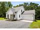 Charming two-story home featuring light siding, a gray roof, and a convenient attached garage at 529 N Central Ave, Locust, NC 28097