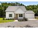 Charming front view of a two-story home with an inviting front porch and meticulously landscaped yard at 529 N Central Ave, Locust, NC 28097