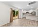 Bright kitchen featuring stainless steel appliances, white cabinetry, and a sliding door that opens to an outdoor patio at 529 N Central Ave, Locust, NC 28097