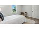 Bright bedroom features hardwood floors, large window, and neutral colors at 617 Rock Hill Church Rd, Matthews, NC 28104