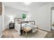 Well lit bedroom features wood floors, natural light, and modern decor at 617 Rock Hill Church Rd, Matthews, NC 28104