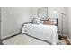 Bedroom with a modern rug, iron bed frame and sleek decor at 617 Rock Hill Church Rd, Matthews, NC 28104