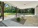 Inviting covered patio with ample space and a view of lush greenery at 617 Rock Hill Church Rd, Matthews, NC 28104