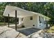 Charming home exterior featuring a covered patio and manicured lawn at 617 Rock Hill Church Rd, Matthews, NC 28104