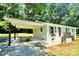 Inviting single-story brick home with a convenient carport and an outdoor seating area at 617 Rock Hill Church Rd, Matthews, NC 28104