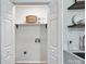 Neat laundry room with sink and shelves, ready for chores at 617 Rock Hill Church Rd, Matthews, NC 28104
