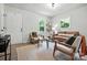 Airy living room featuring contemporary furnishings, neutral colors, and plenty of natural light at 617 Rock Hill Church Rd, Matthews, NC 28104
