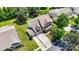Aerial view of brick home with well maintained yard, mature trees, and large driveway at 646 Quicksilver Trl # 183, Fort Mill, SC 29708