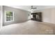 Spacious room with built-in TV console and windows at 646 Quicksilver Trl # 183, Fort Mill, SC 29708