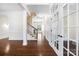 Open foyer with hardwood flooring, decorative wainscotting and French doors leading to the front office at 646 Quicksilver Trl # 183, Fort Mill, SC 29708