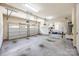 Spacious three-car garage featuring automatic doors, overhead lighting, and a utility sink at 646 Quicksilver Trl # 183, Fort Mill, SC 29708