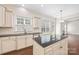 Updated kitchen with black countertops, white cabinets and stainless dishwasher at 646 Quicksilver Trl # 183, Fort Mill, SC 29708